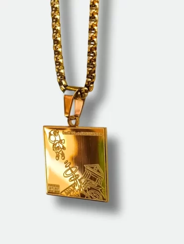 Front view of gold pendant featuring Kanye West's "Graduation" album cover and back view with engraved tracklist