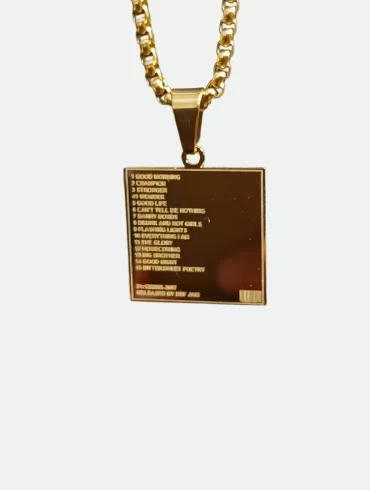 Front view of gold pendant featuring Kanye West's "Graduation" album cover and back view with engraved tracklist
