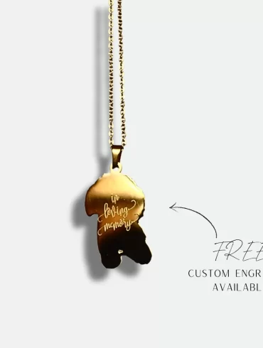Gold pendant with a hand-drawn illustration of a dog and custom engraving