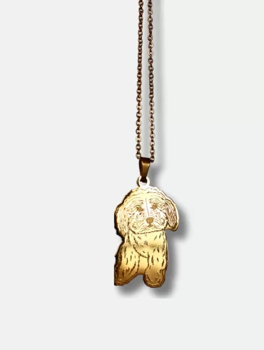 Gold pendant with a hand-drawn illustration of a dog and custom engraving