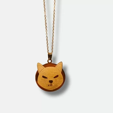 Gold-plated Shiba Inu pendant featuring the SHIB logo and a HODL engraving on the back.
