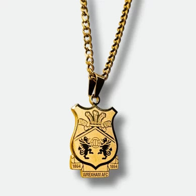 A gold-plated Wrexham AFC pendant necklace, featuring a custom engraving of the club’s crest and the phrase "I ❤️ Wrexham".